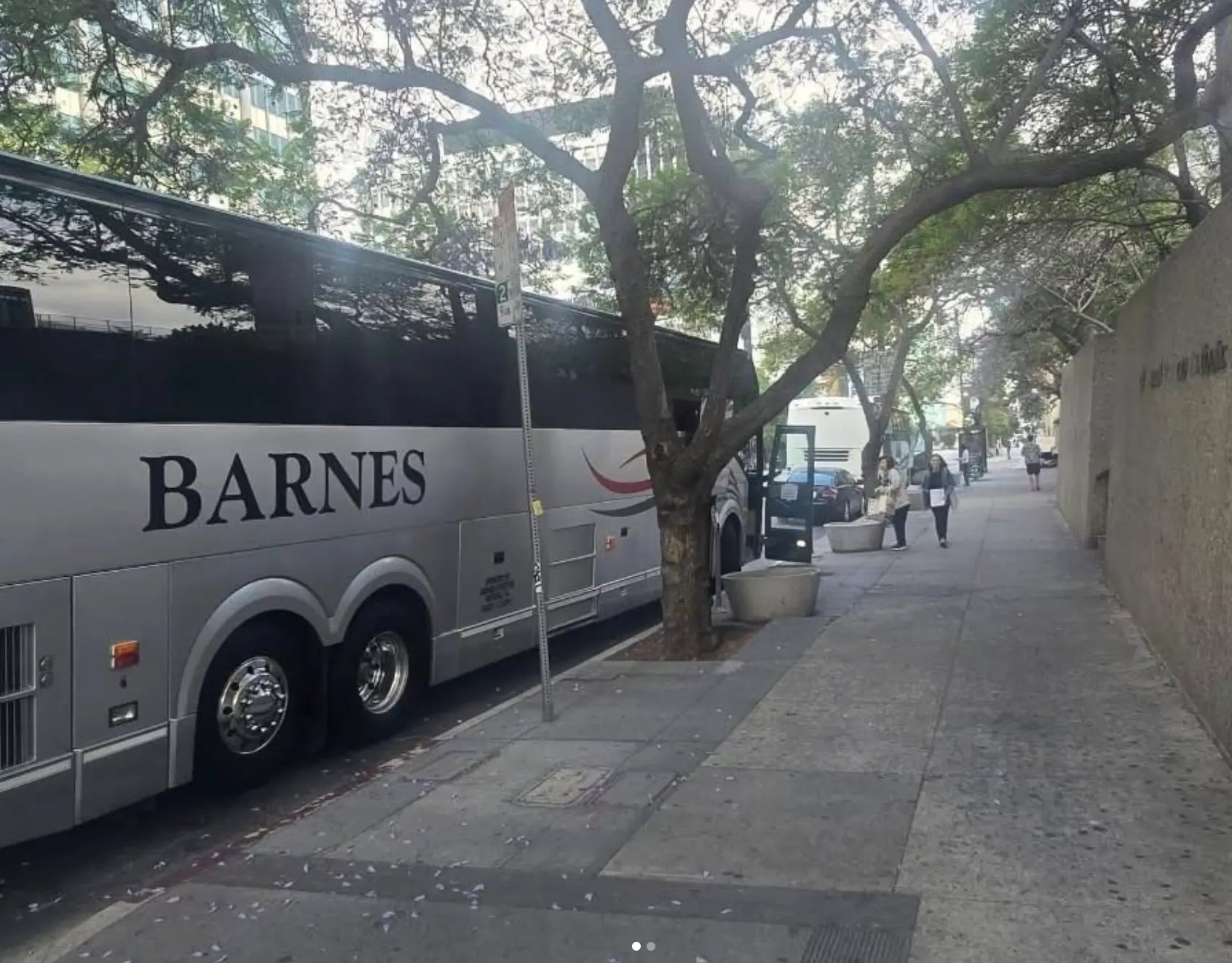 Charter bus at a city curbside pickup