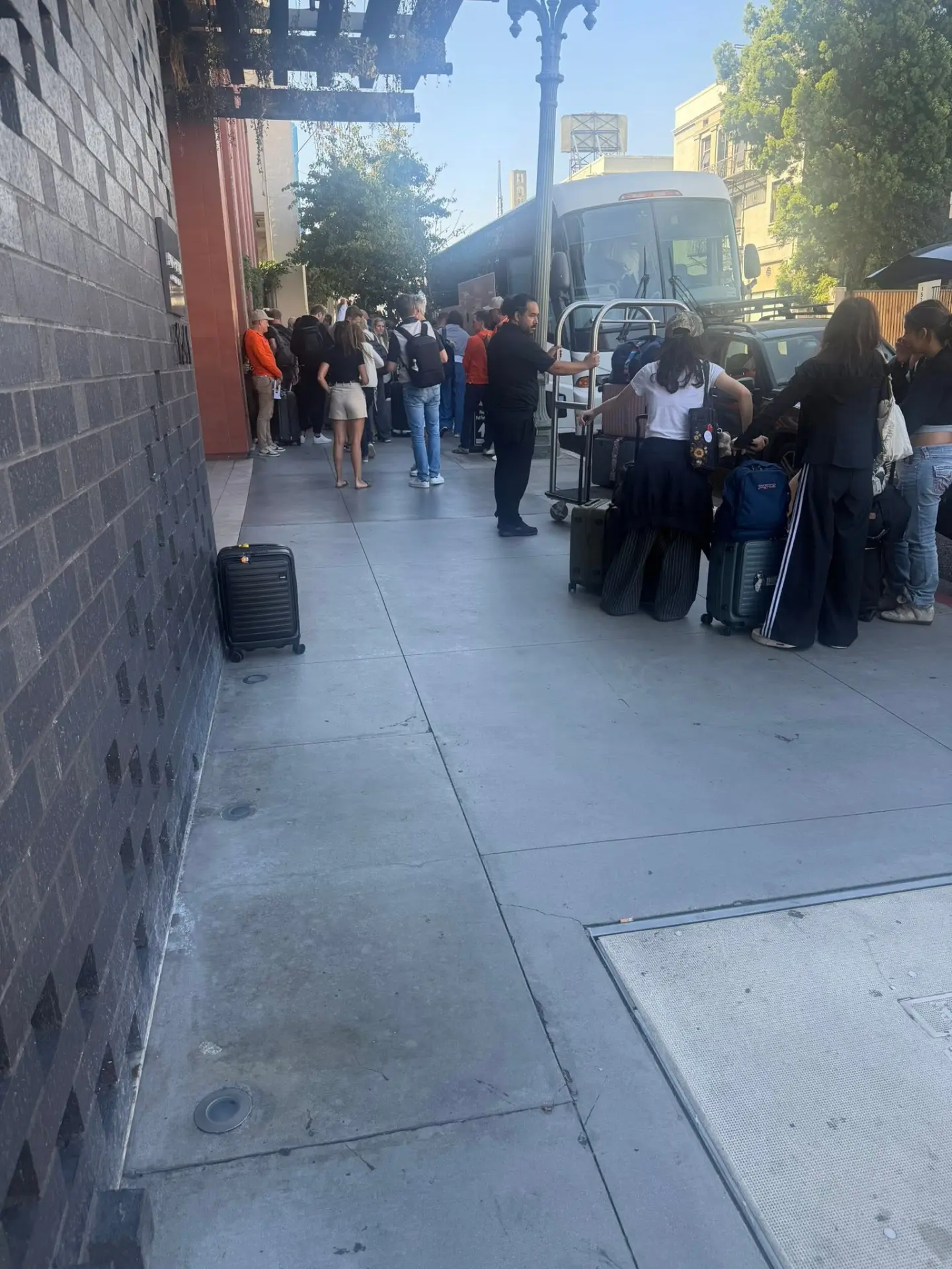 A group boarding a charter bus